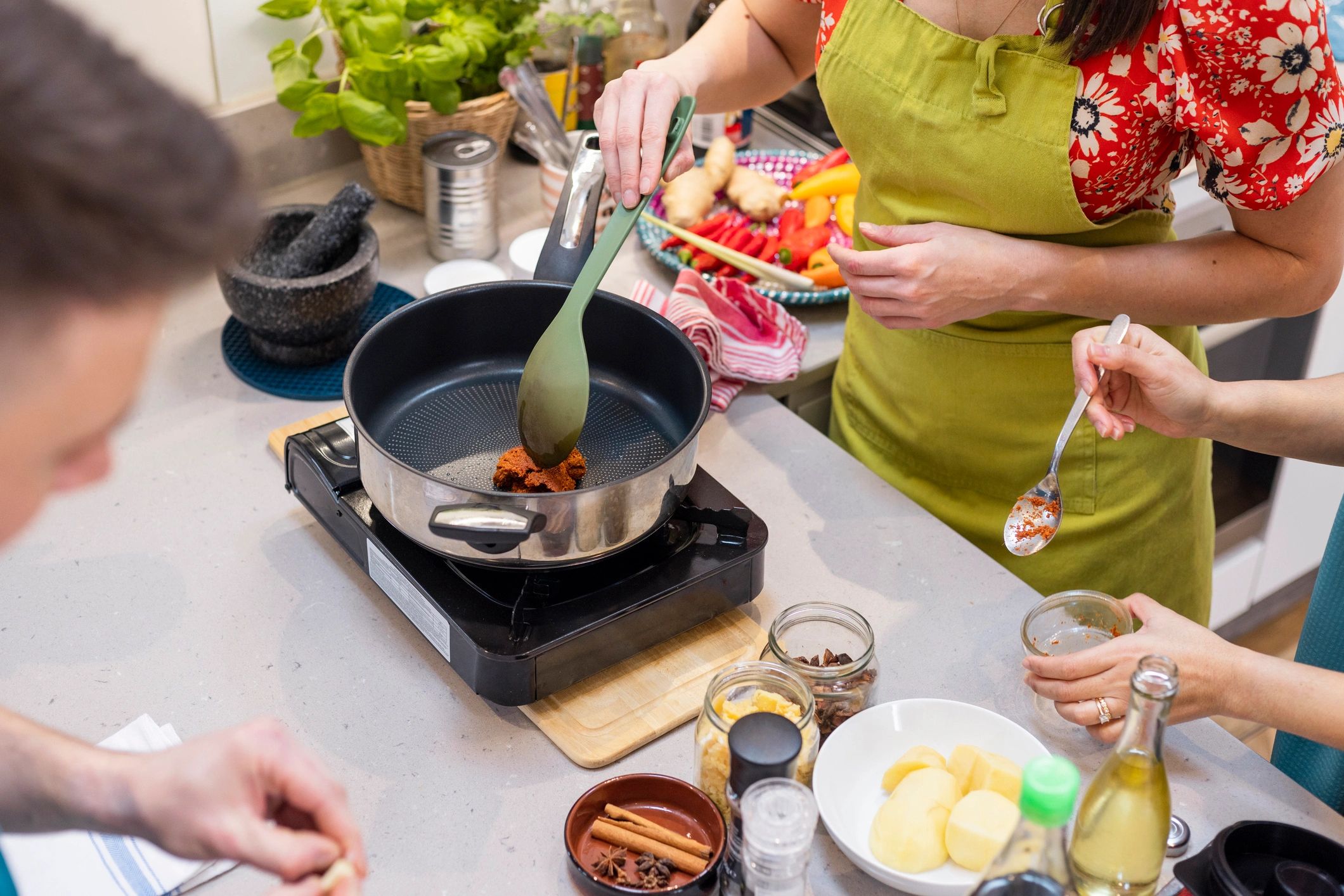 Adults participating in a hands-on cooking workshop