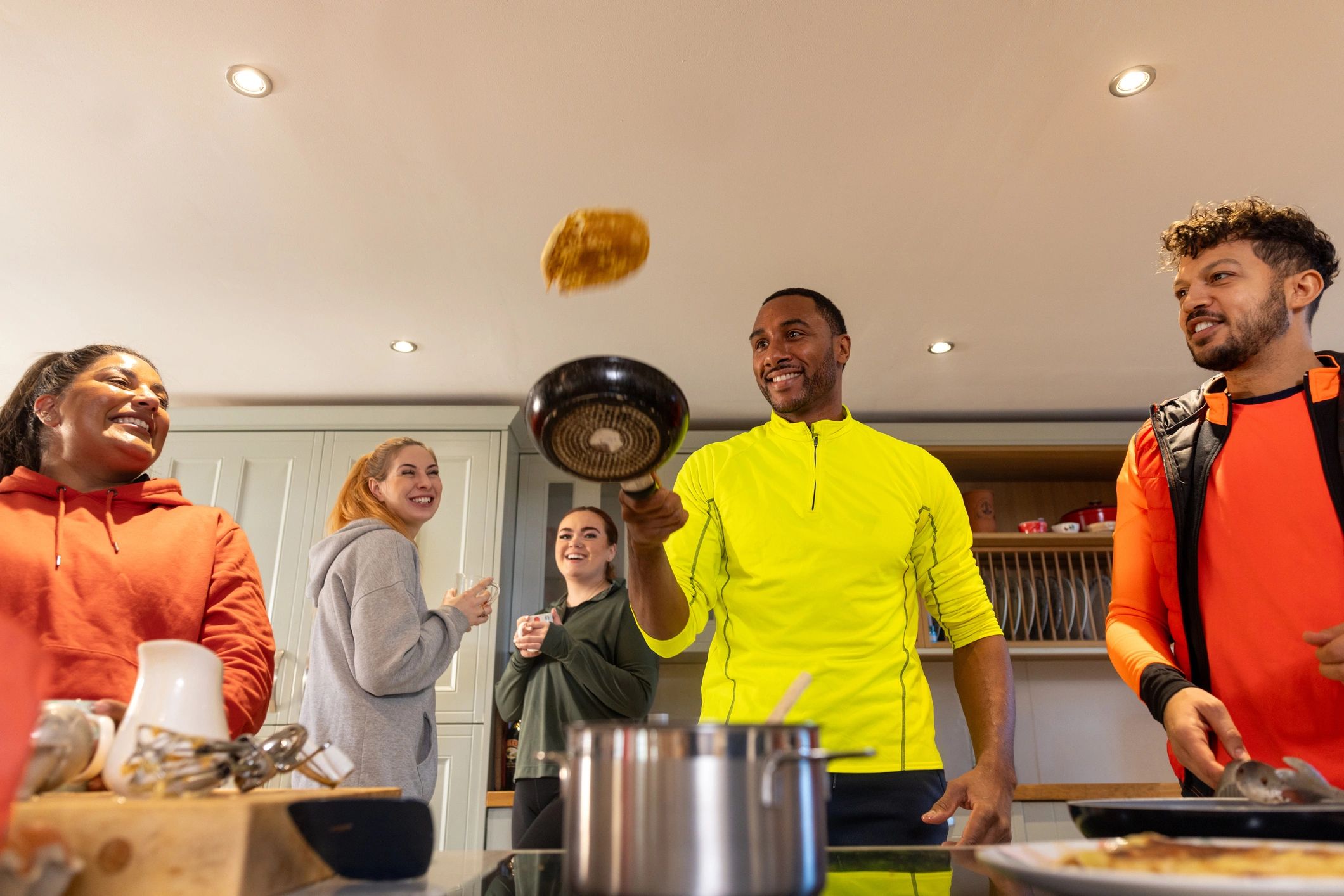 Participants cooking together in a workshop kitchen