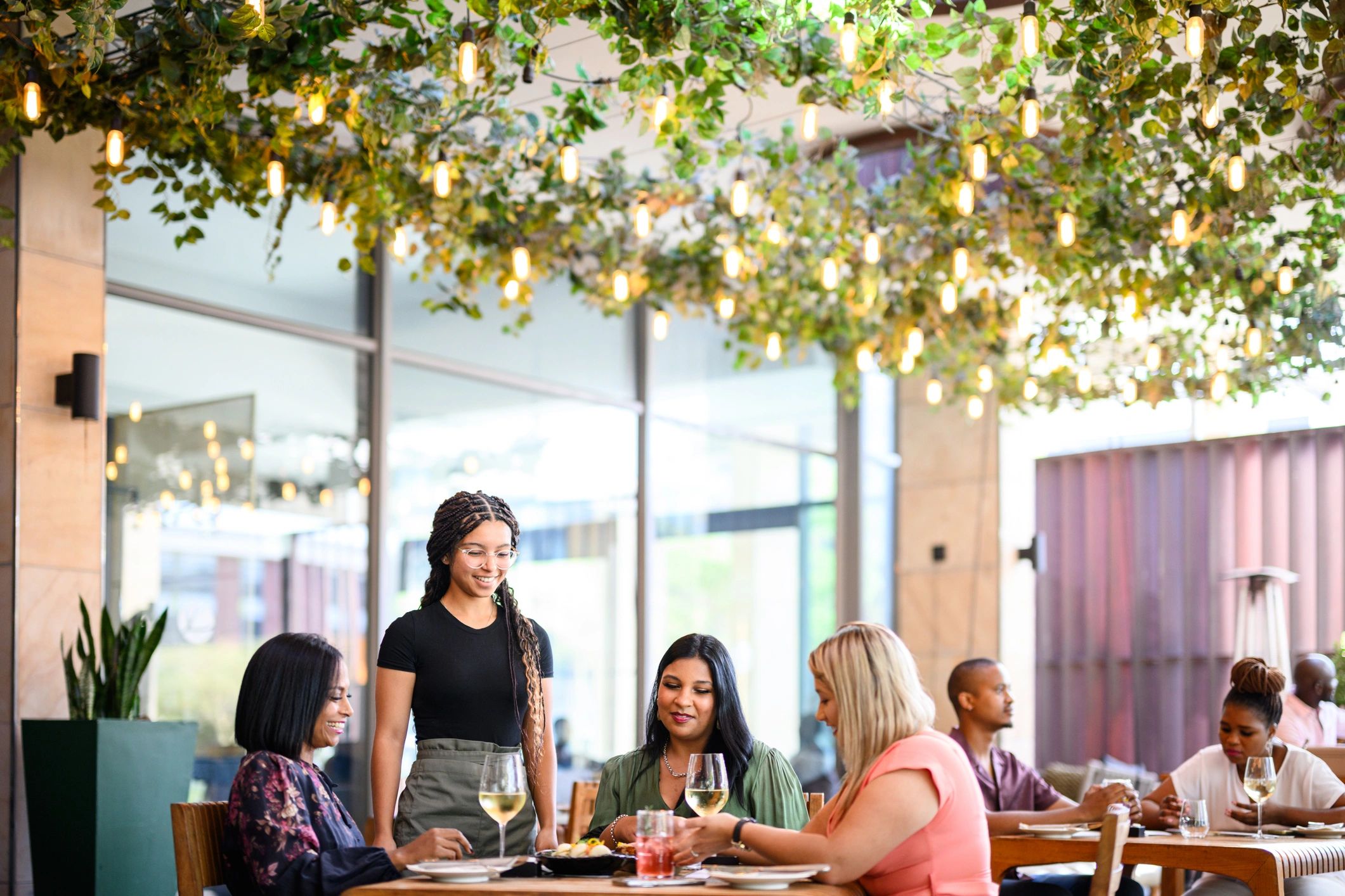 Guests enjoying a premium restaurant terrace dining experience