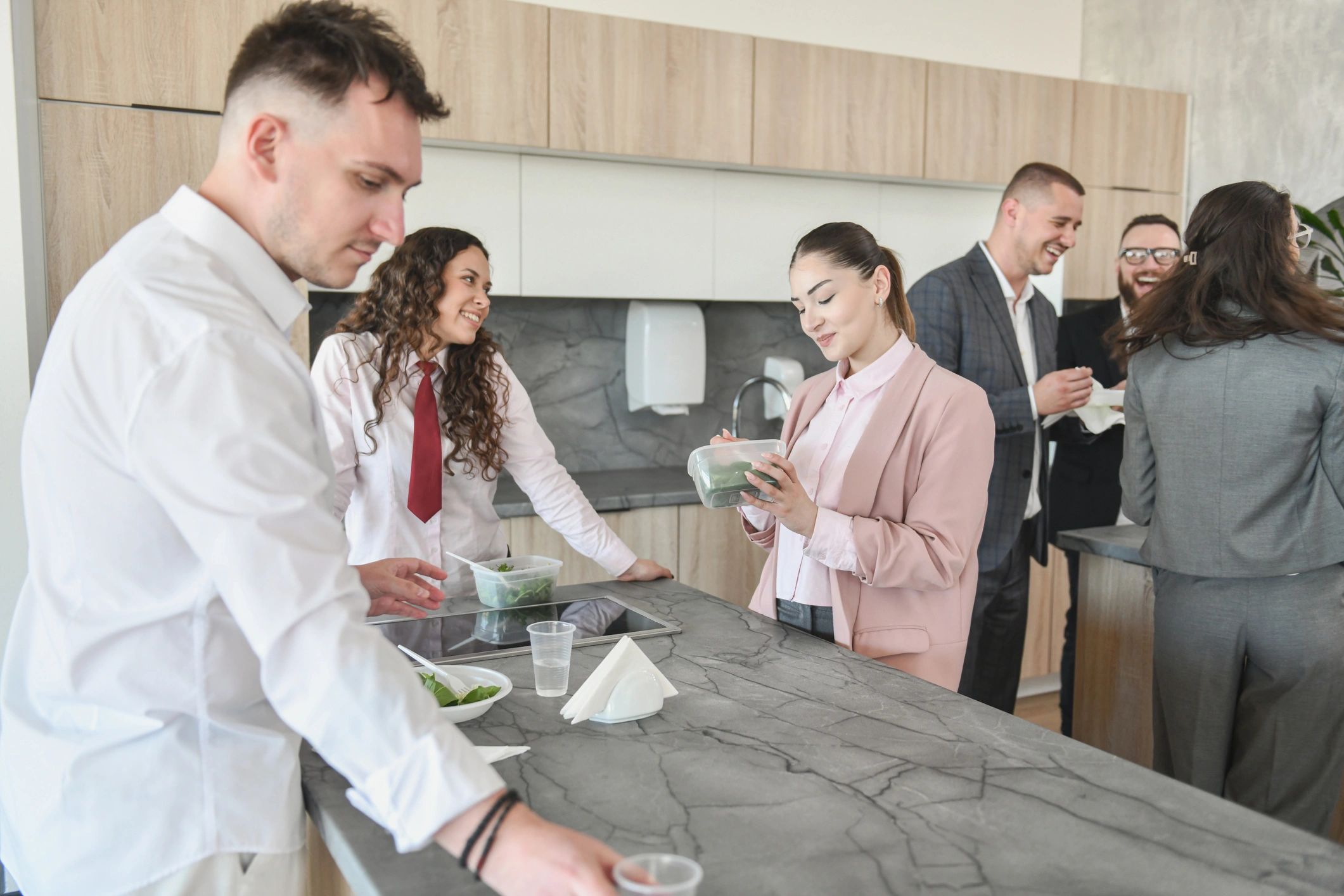 Office teams enjoying casual break time together